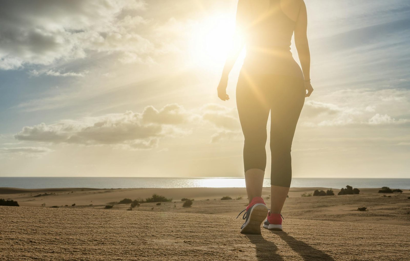 https://www.pexels.com/photo/woman-walking-on-deserted-beach-at-sunset-29397798/