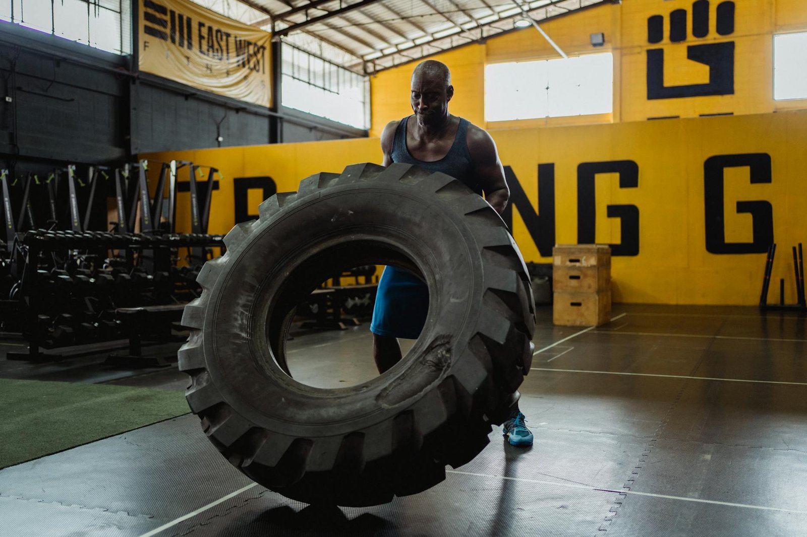 https://www.pexels.com/photo/man-carrying-tire-4720833/