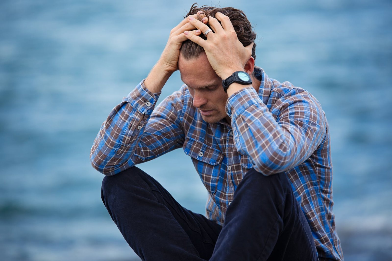 https://www.pexels.com/photo/man-in-blue-and-brown-plaid-dress-shirt-touching-his-hair-897817/